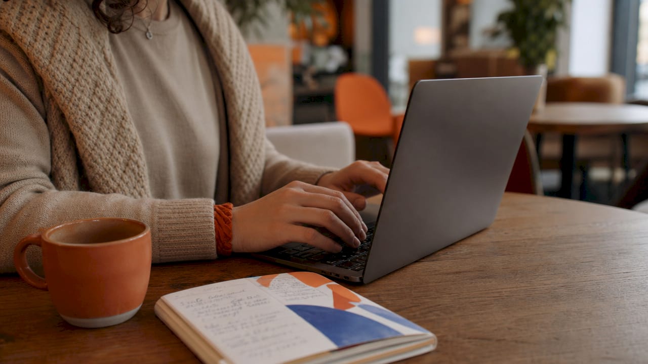 Hands typing localization code in home office