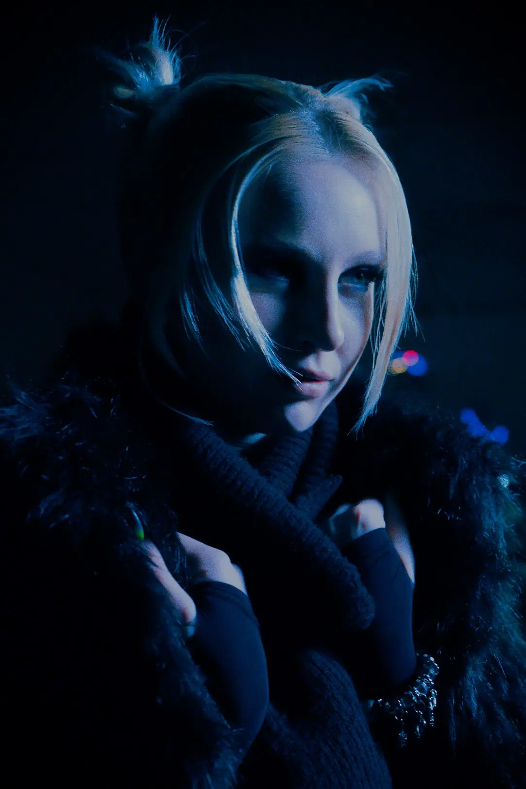 A girl in the night staring into the distance at an X ANIMA shoot