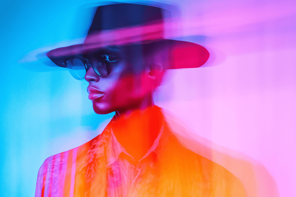 A woman standing in front of a colorful wall