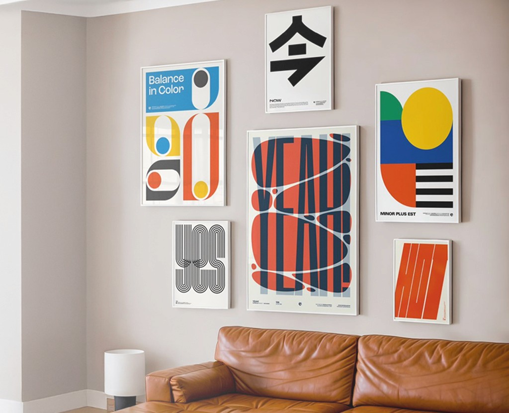 Interior scene with a gallery of colorful graphic posters and a leather couch, featuring the text "THE PSYCHOLOGY OF COLORS & TYPOGRAPHY IN BRANDING" on the left.