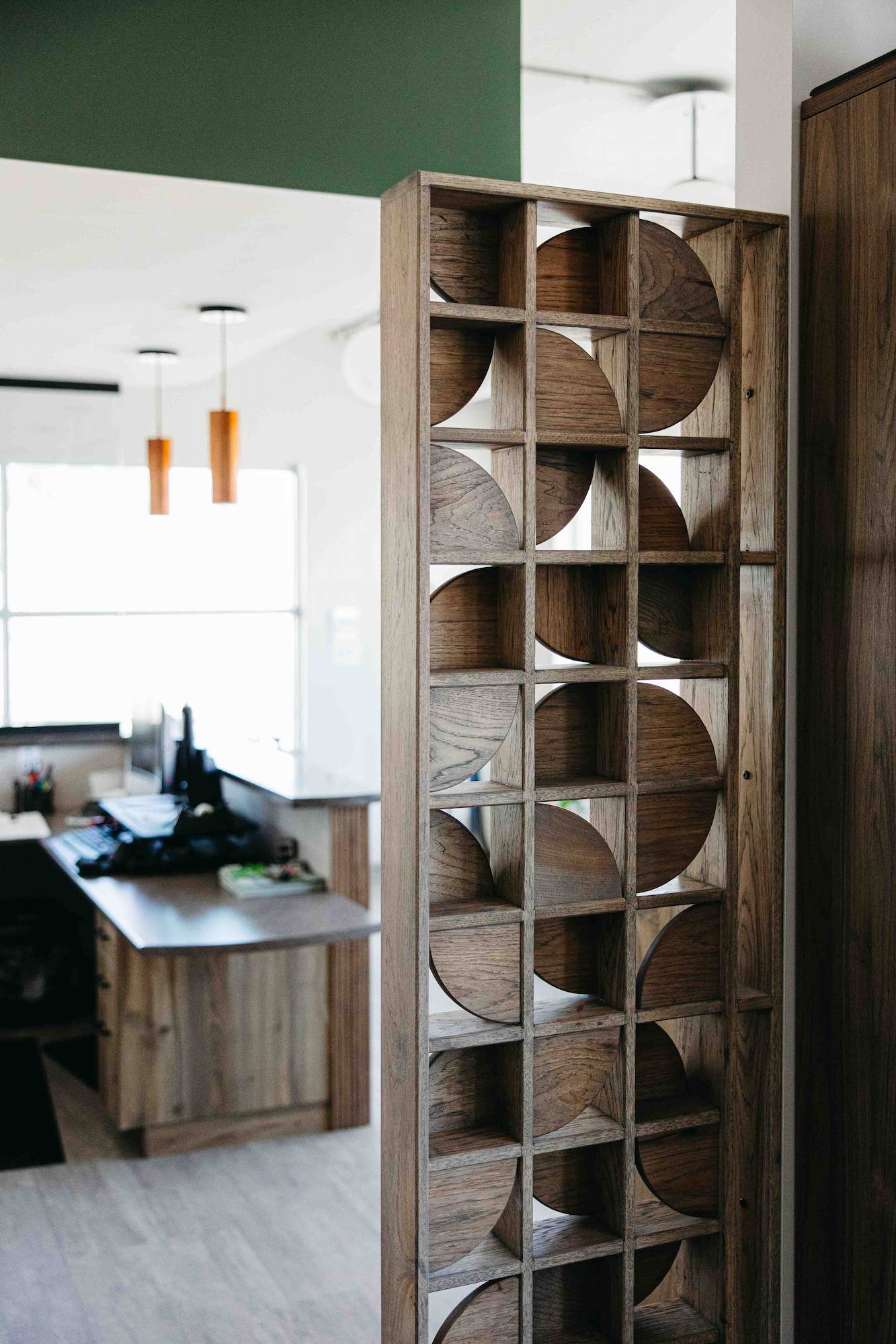 Reverse side of the custom woodworking feature wall at Crosby Hanna Saskatoon