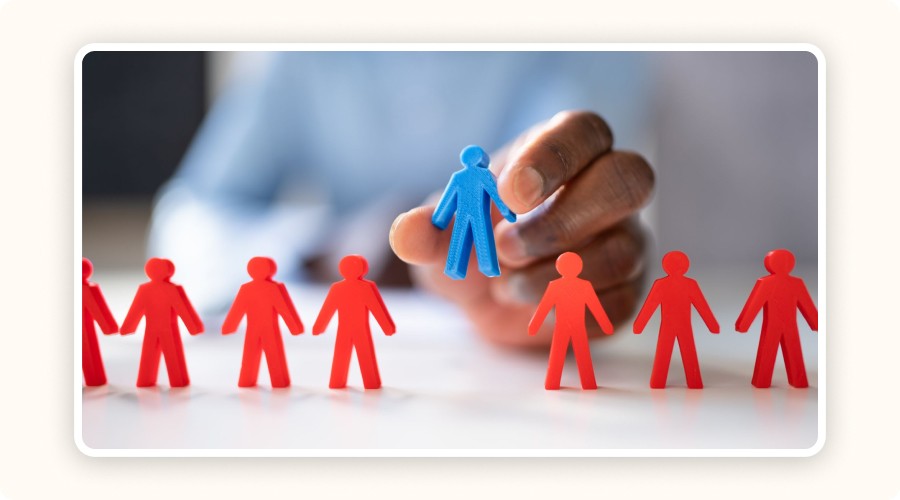 blue figurine among red figurines