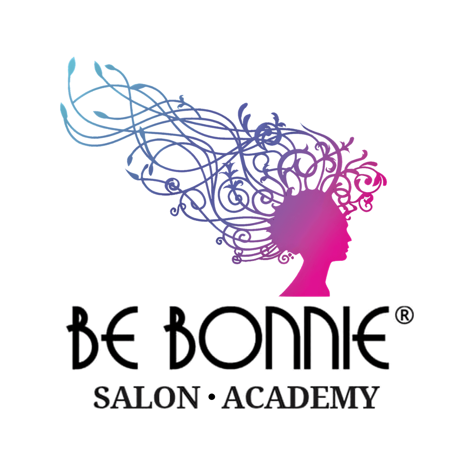 Young man in a blue suit stands confidently in a stylish kitchen, backlit by warm pendant lights. His expression is calm and poised.