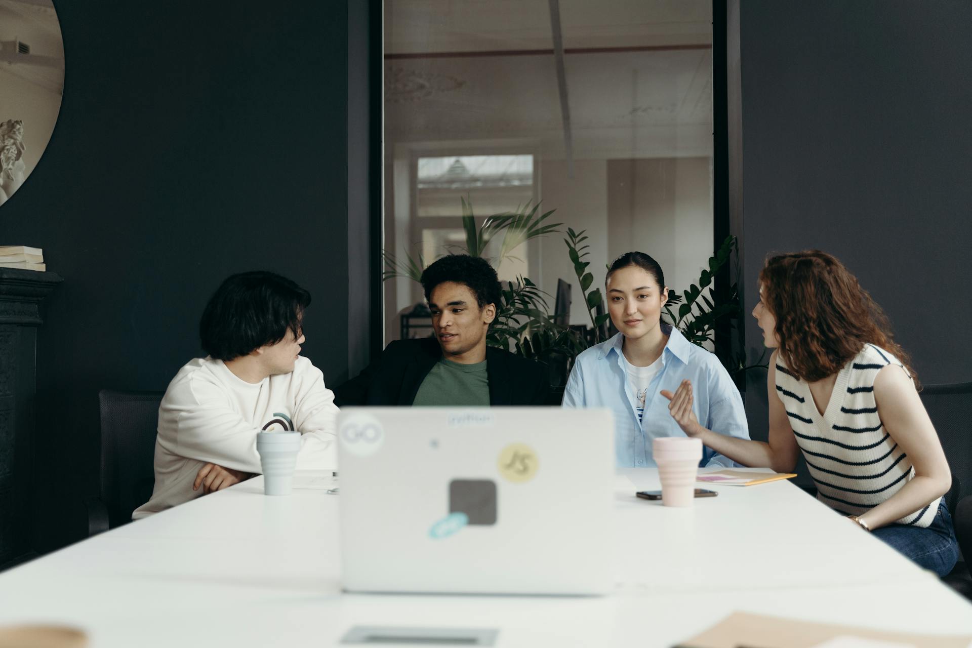 A team seated in the office having a discussion.