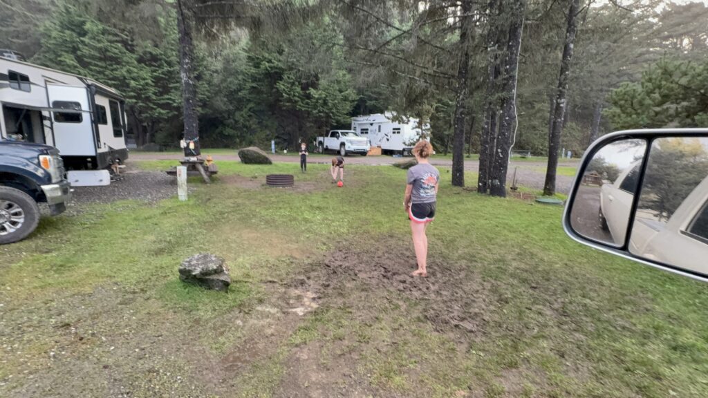 Kids playing at our campsite at Turtle Rock RV Resort in Gold Beach
