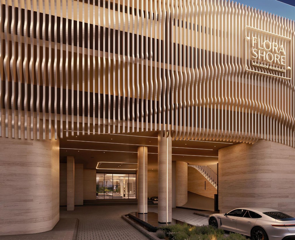 Contemporary building at Flora Shore Beachfront Residences with a pool and a spacious balcony.