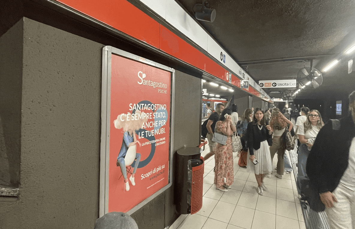 Santagostino Psiche mental wellness advertising in Milan metro station platform showing brand messaging about psychological support accessibility - out-of-home media activation by Alessandro Brancati Marketing & Growth Studio