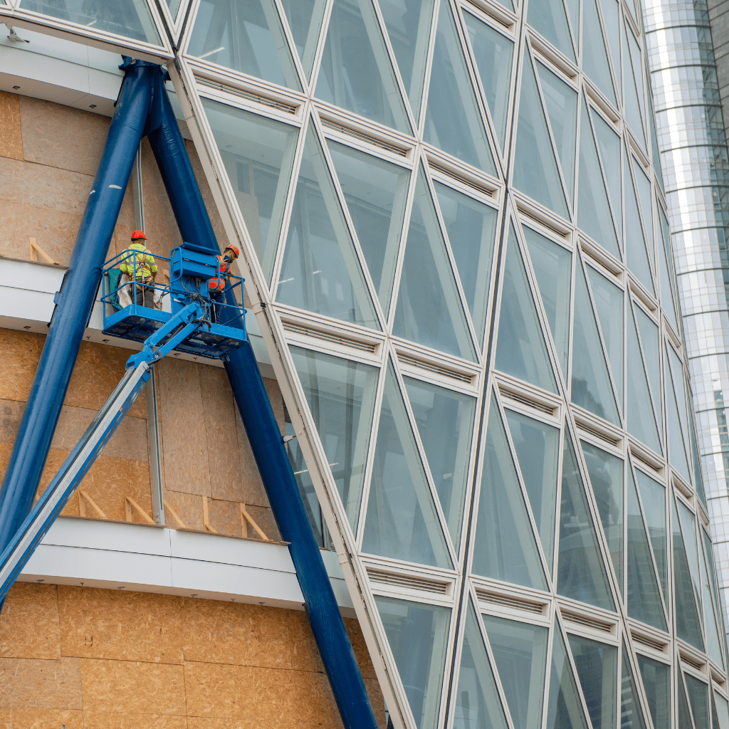 two people looking at a tablet and smiling
