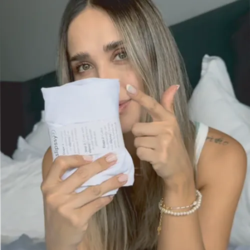 woman influencer in her bedroom showing a folded PuFlow