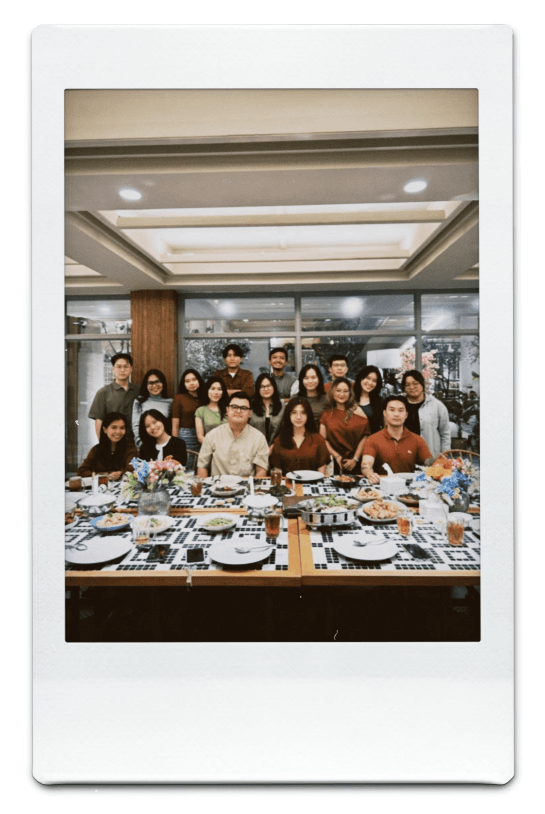 People playing soccer on a rooftop court surrounded by city buildings