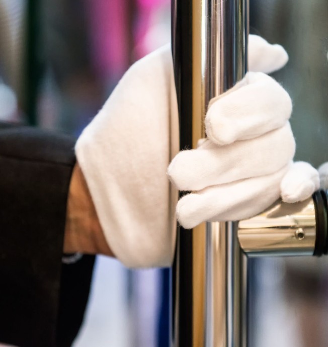 Group of people standing in a grassy field