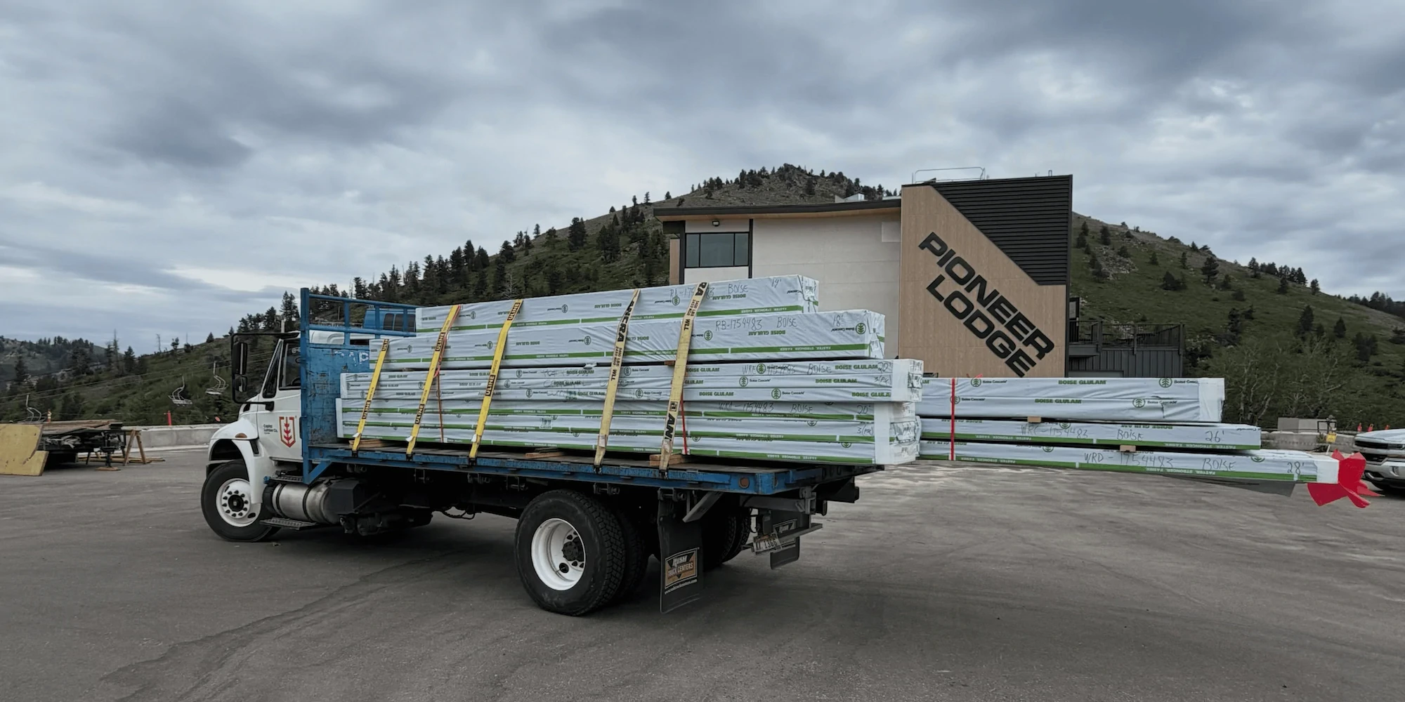 Capital Lumber flatbed truck delivering building material to Pioneer Lodge at Bogus Basin