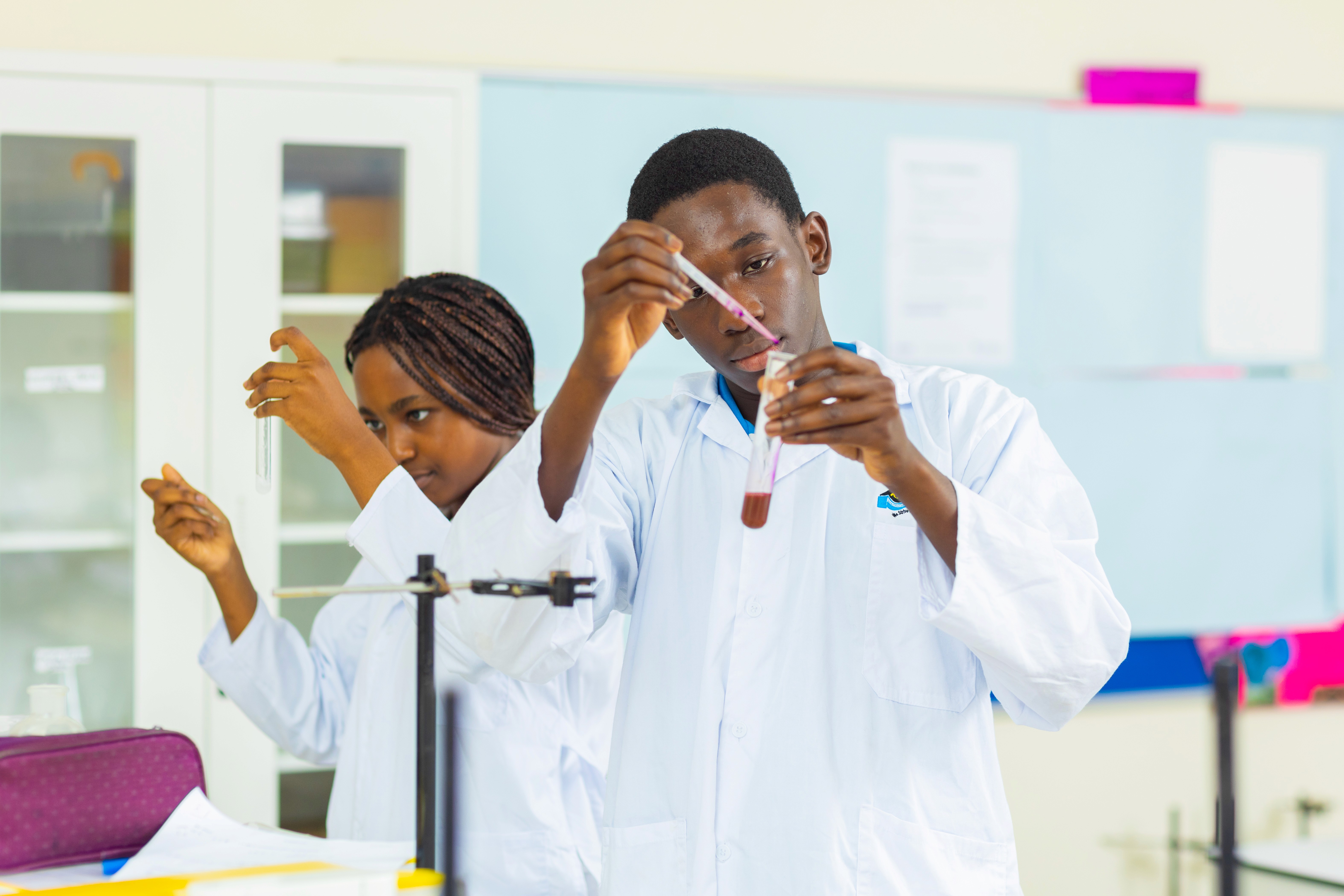 A student stands with a backpack on, ready for school