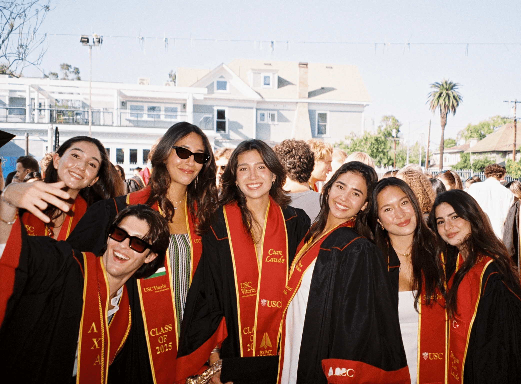 woman holding a phone and man looking at the phone. both are smiling