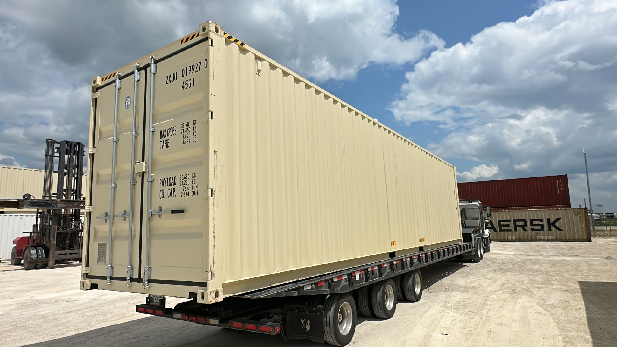 40' High Cube New Beige container being loaded for delivery at the depot