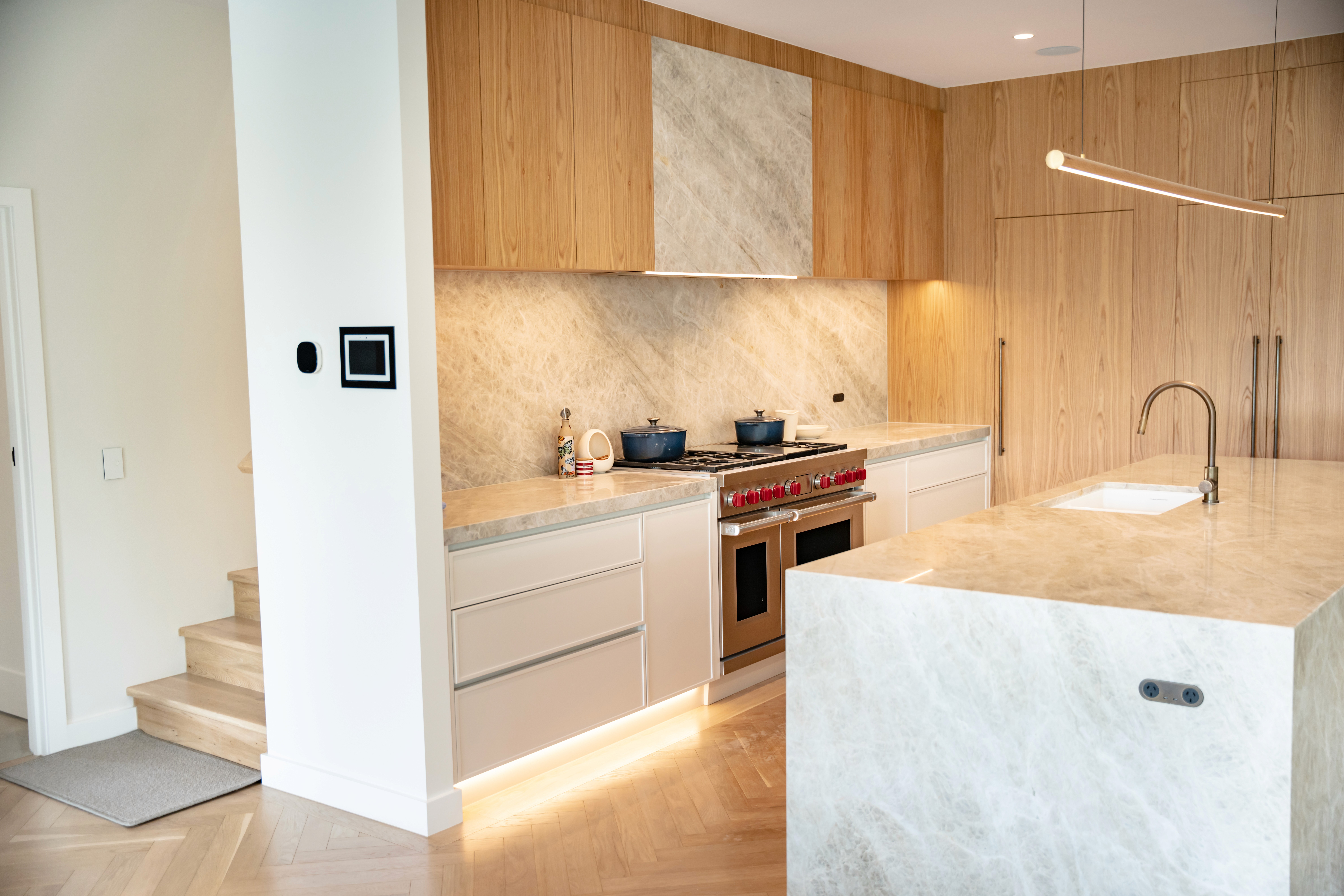 Contemporary kitchen with natural stone and timber joinery within the Ardoch heritage extension