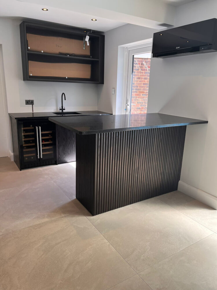 Kitchen unit sprayed in a black colour.