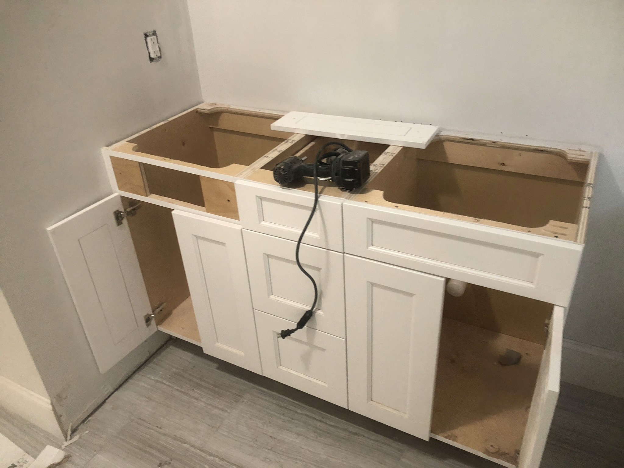 white wooden kitchen cabinet and white kitchen counter