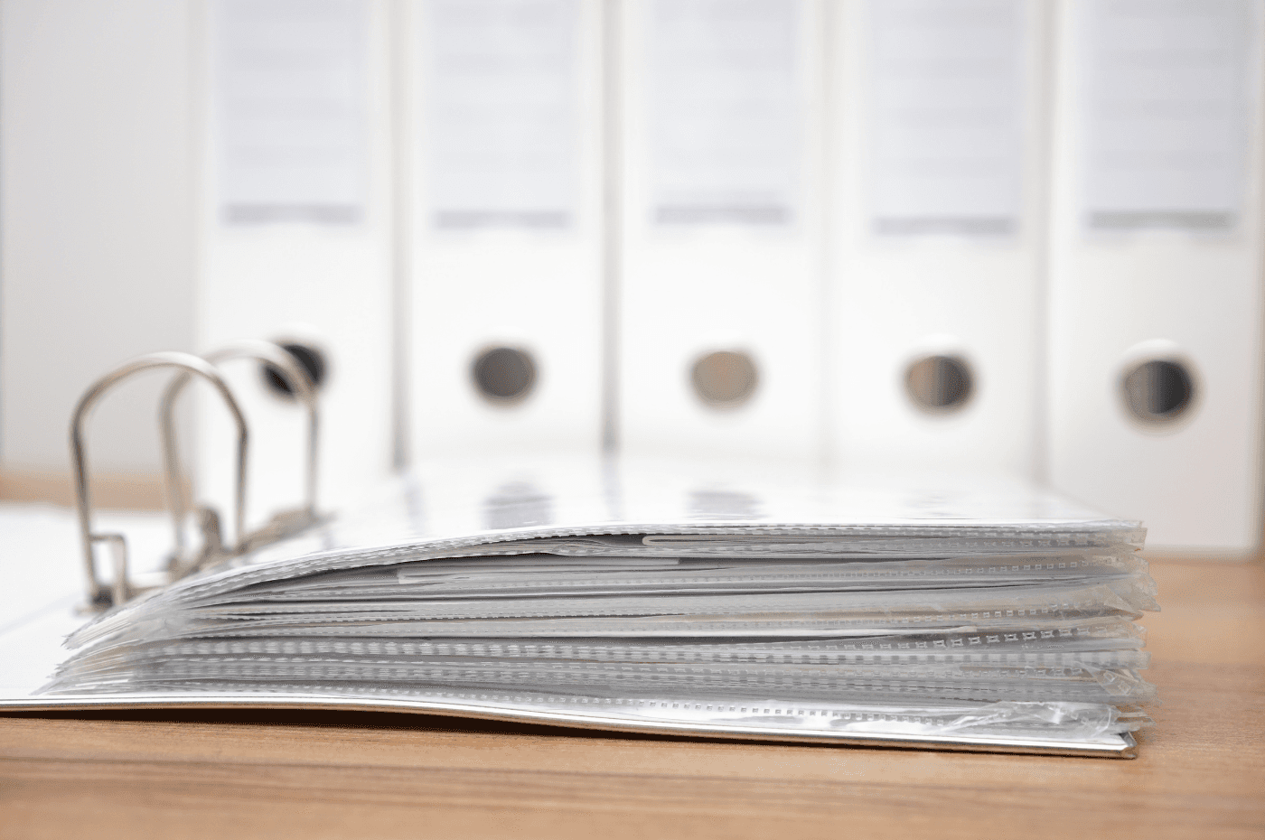 folders with documentation with binders in background