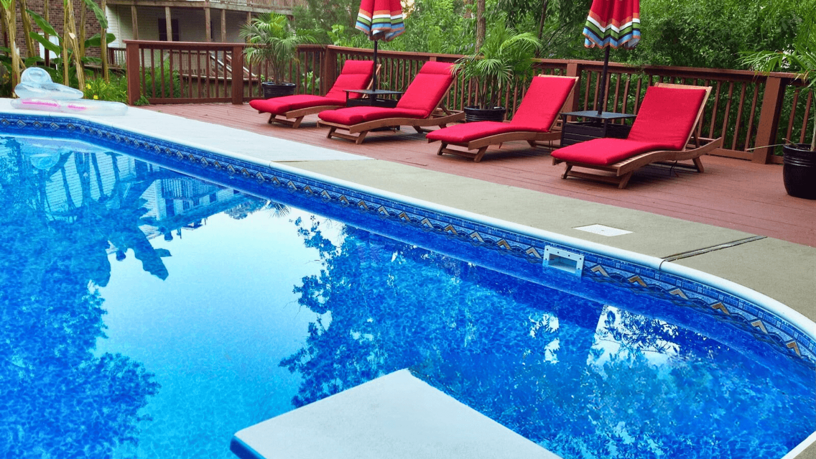 Vinyl pool with custom liner design in a landscaped Ohio backyard