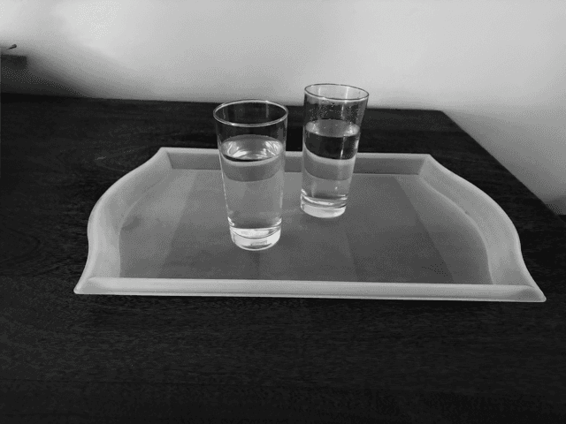 2 glasses of water on a tray