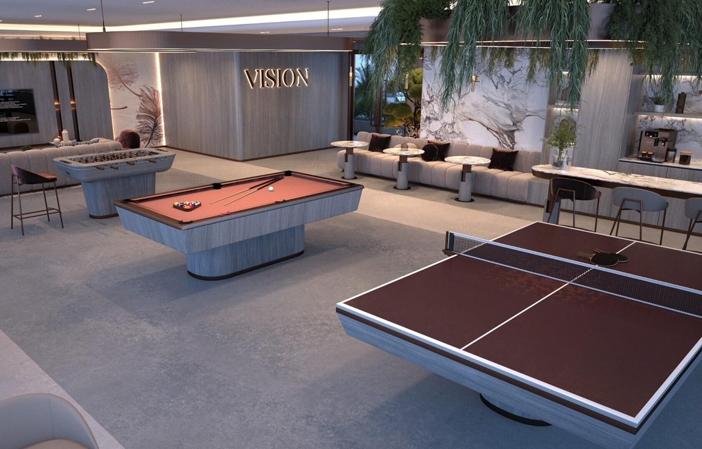 Interior of a game room with multiple pool tables and a ping pong table, created by Vista by Vision.