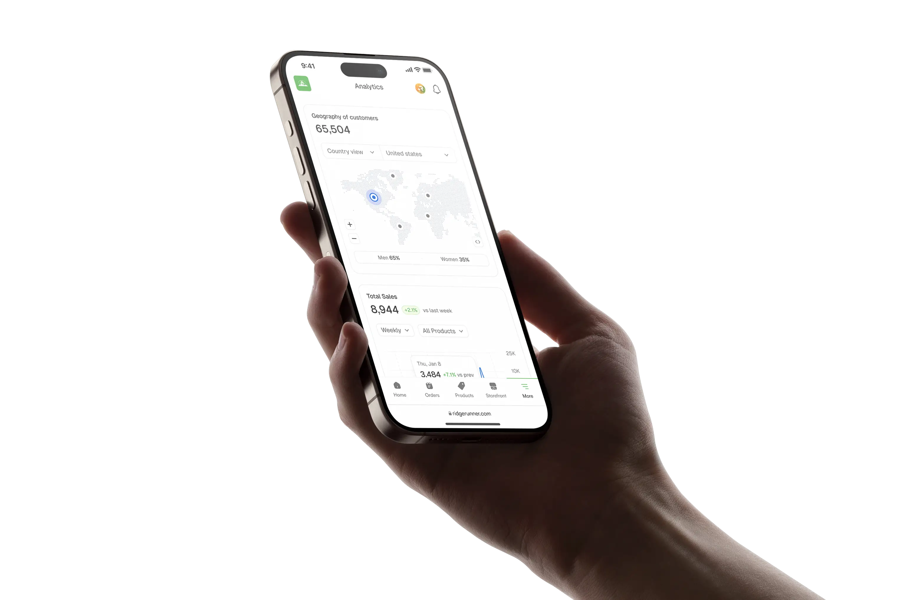 A hand holding a phone showing a website interface