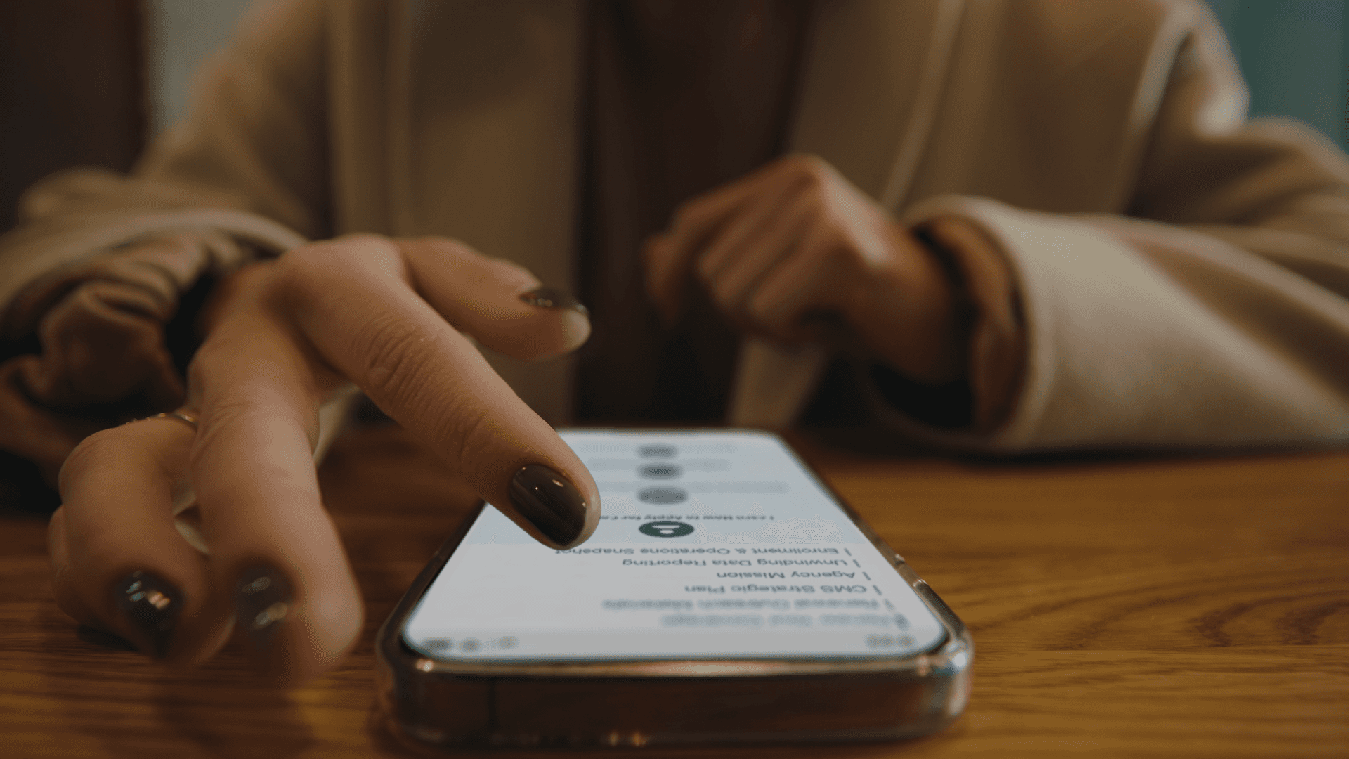 A woman using the Medicaid website on her phone.