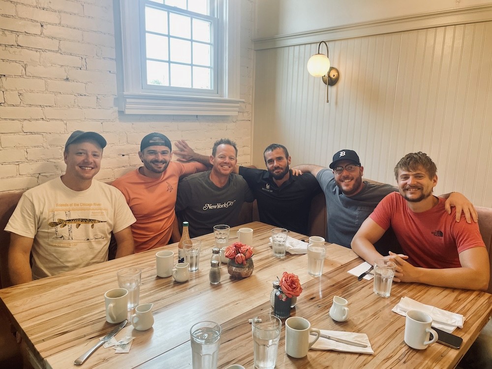 guys eating breakfast together