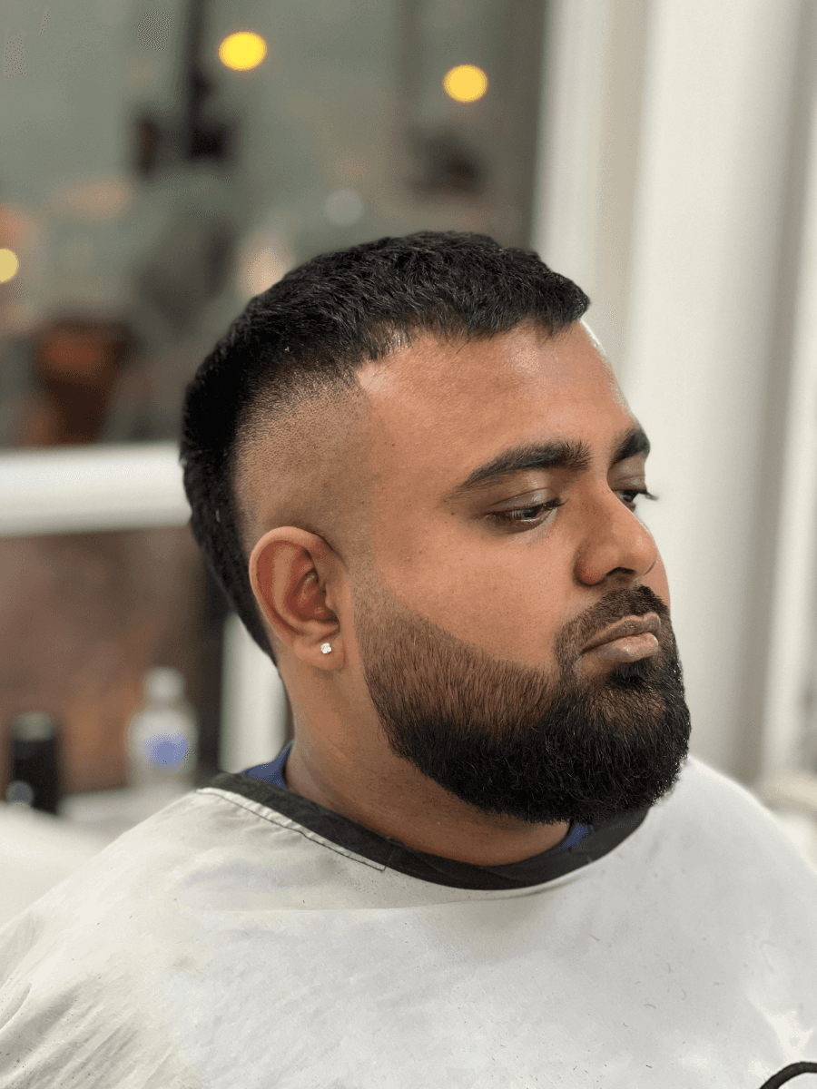 white and brown rabbit looking at camera