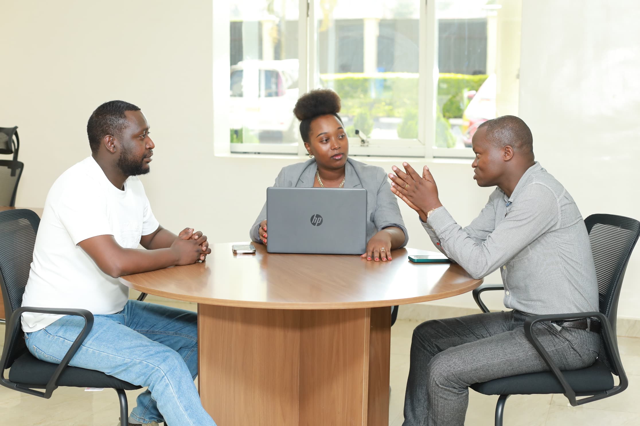 In chemical manufacturing lab,close up shot of a hand pouring liquid in a small glass bottle