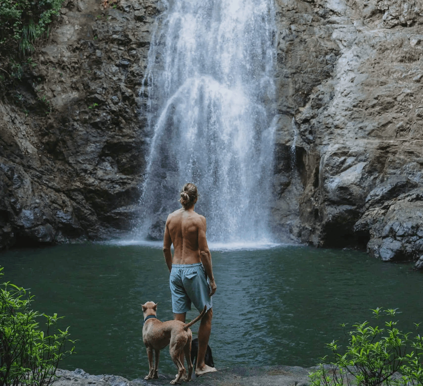 a large stone sculpture with Great Sphinx of Giza in the background