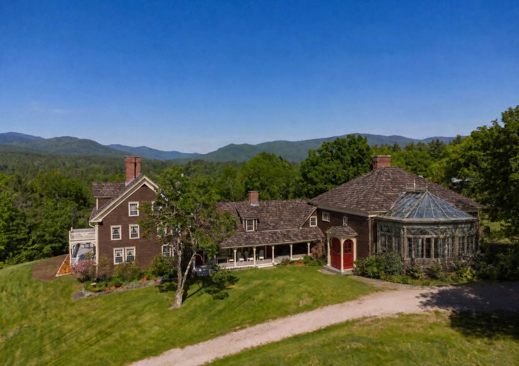 Aerial view of the prospective Hearthstone property with mountains beyond