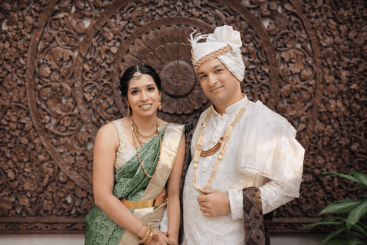 selective focus photo of man standing holding DSLR camera