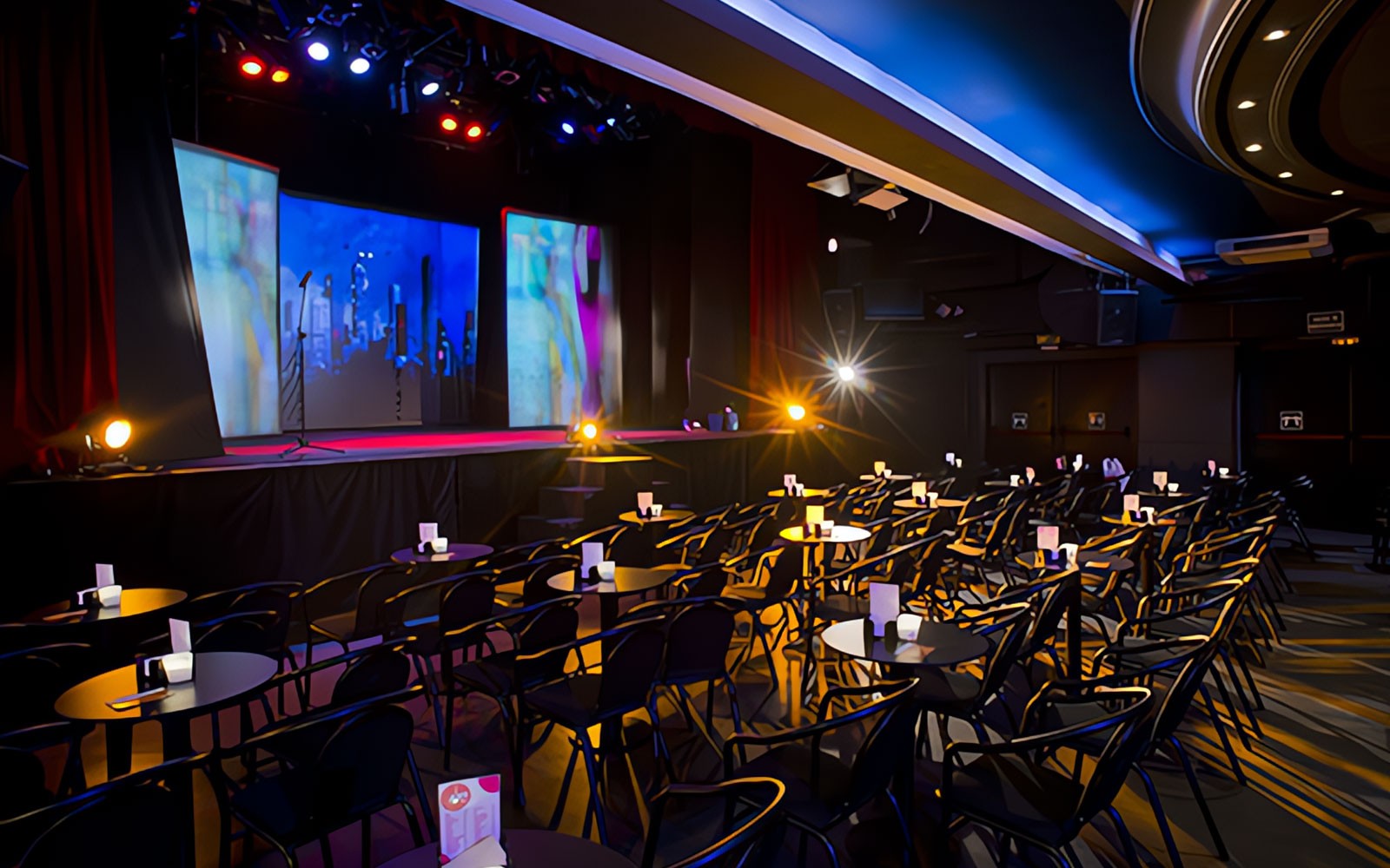 Teatro Flamenco Madrid stage set for Emotions Show with seating and colorful lights.