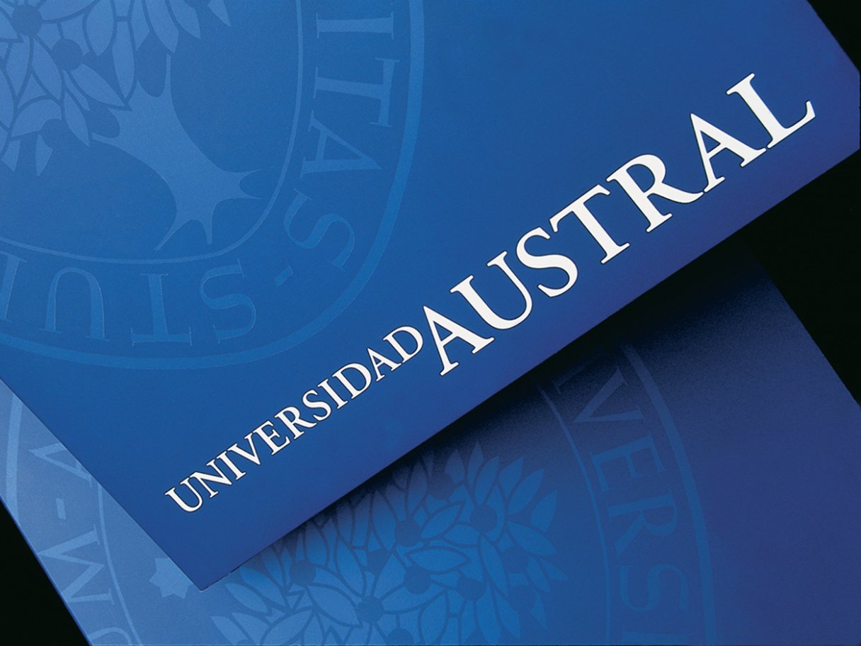 Rooftops of a coastal town with the sea in background