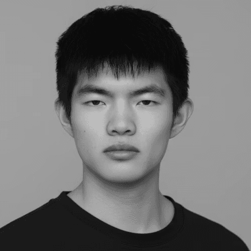 Portrait of a woman with long, smooth hair swept to the side, in a dark t-shirt, on a plain background.