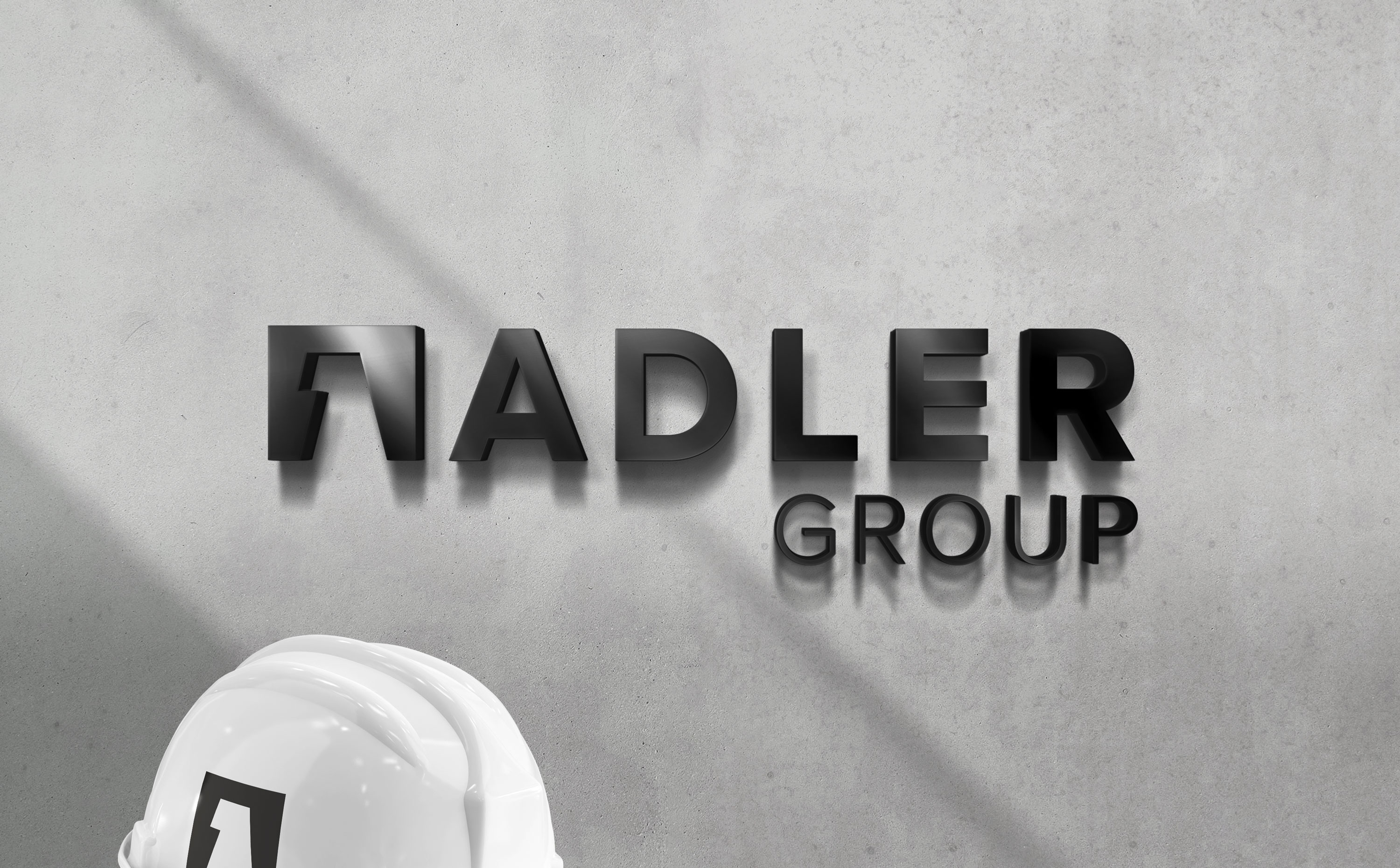Logo Design und Markenauftritt für die Adler Group – modernes, reduziertes Corporate Design mit klarer Typografie.