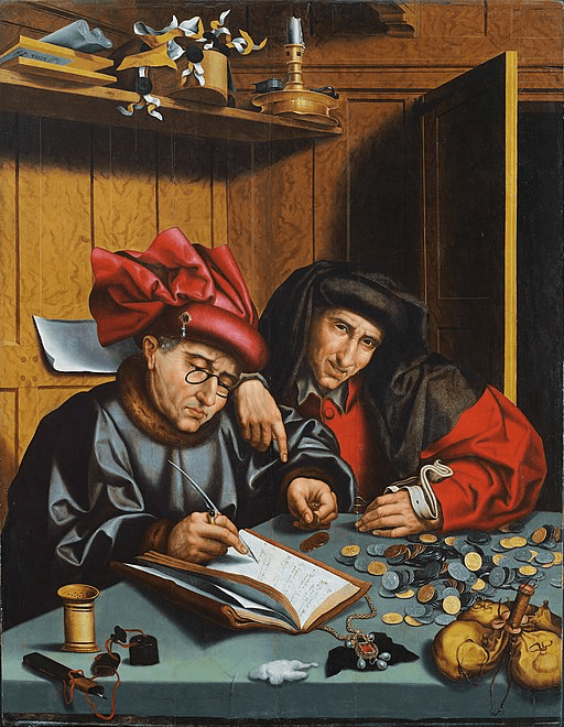 Two men are examining a book on a table, surrounded by tools and objects, in a dimly lit interior.
