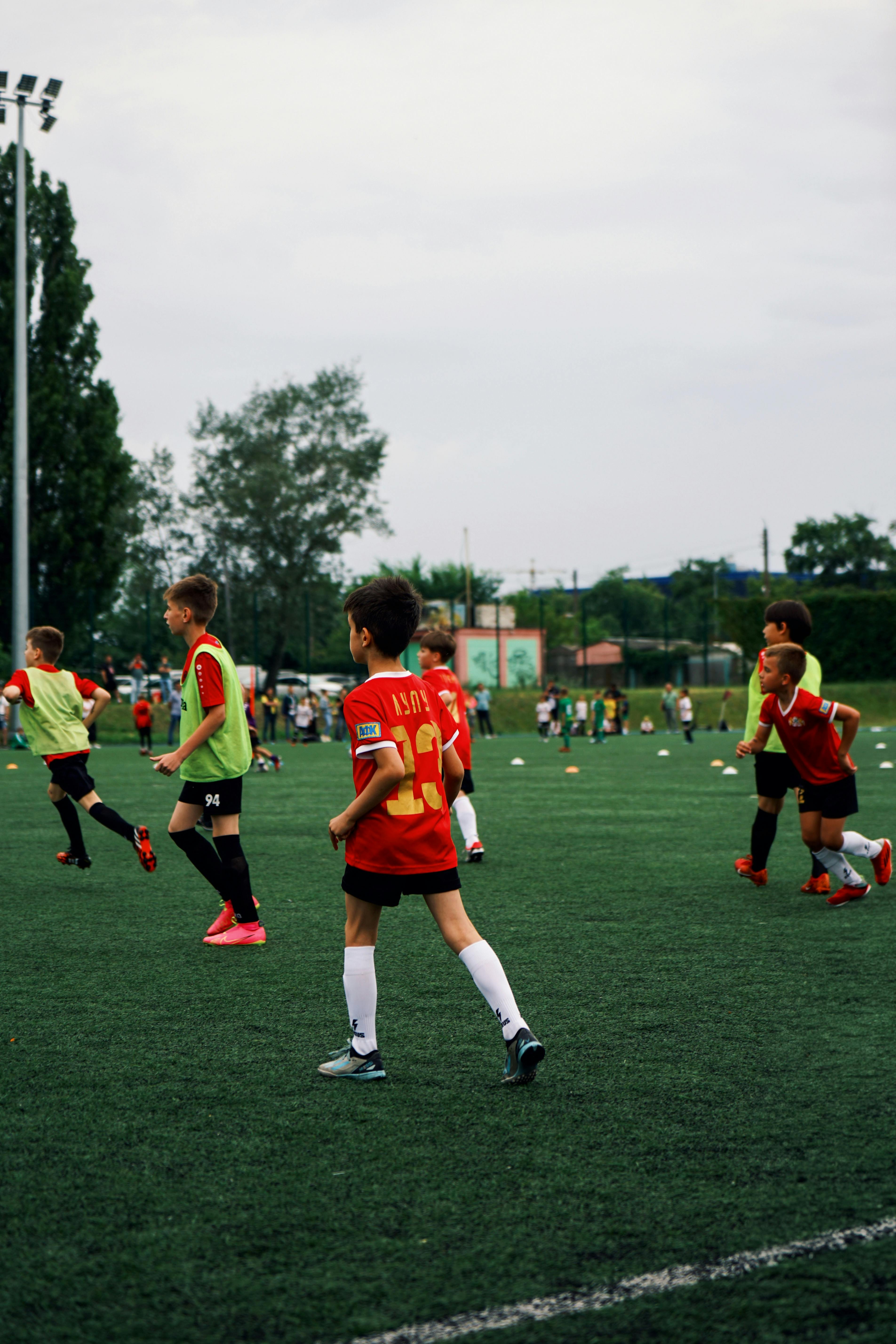 young-kids-playing-soccer-on-a-green-field-during-the-day.-engaged-in-a-fun-spor - nn.ton.nn (pexels)