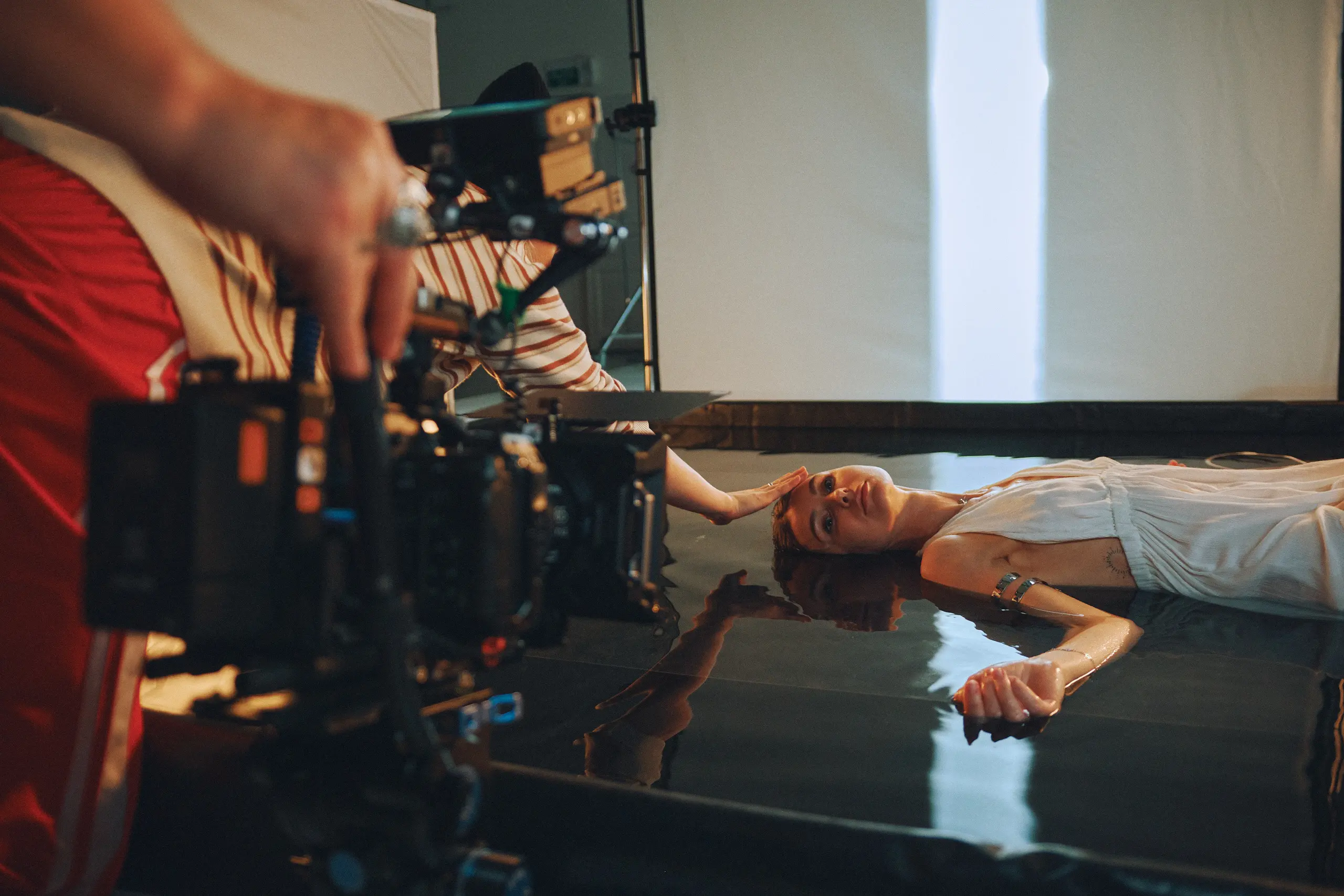 WA woman lying on the floor being filmed