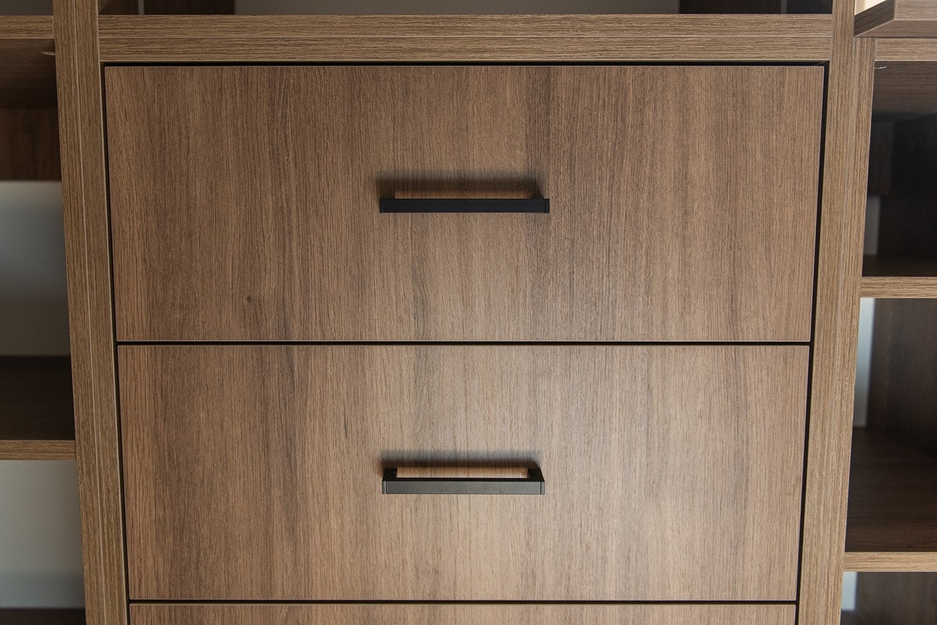 Close-up of wood drawers with handles