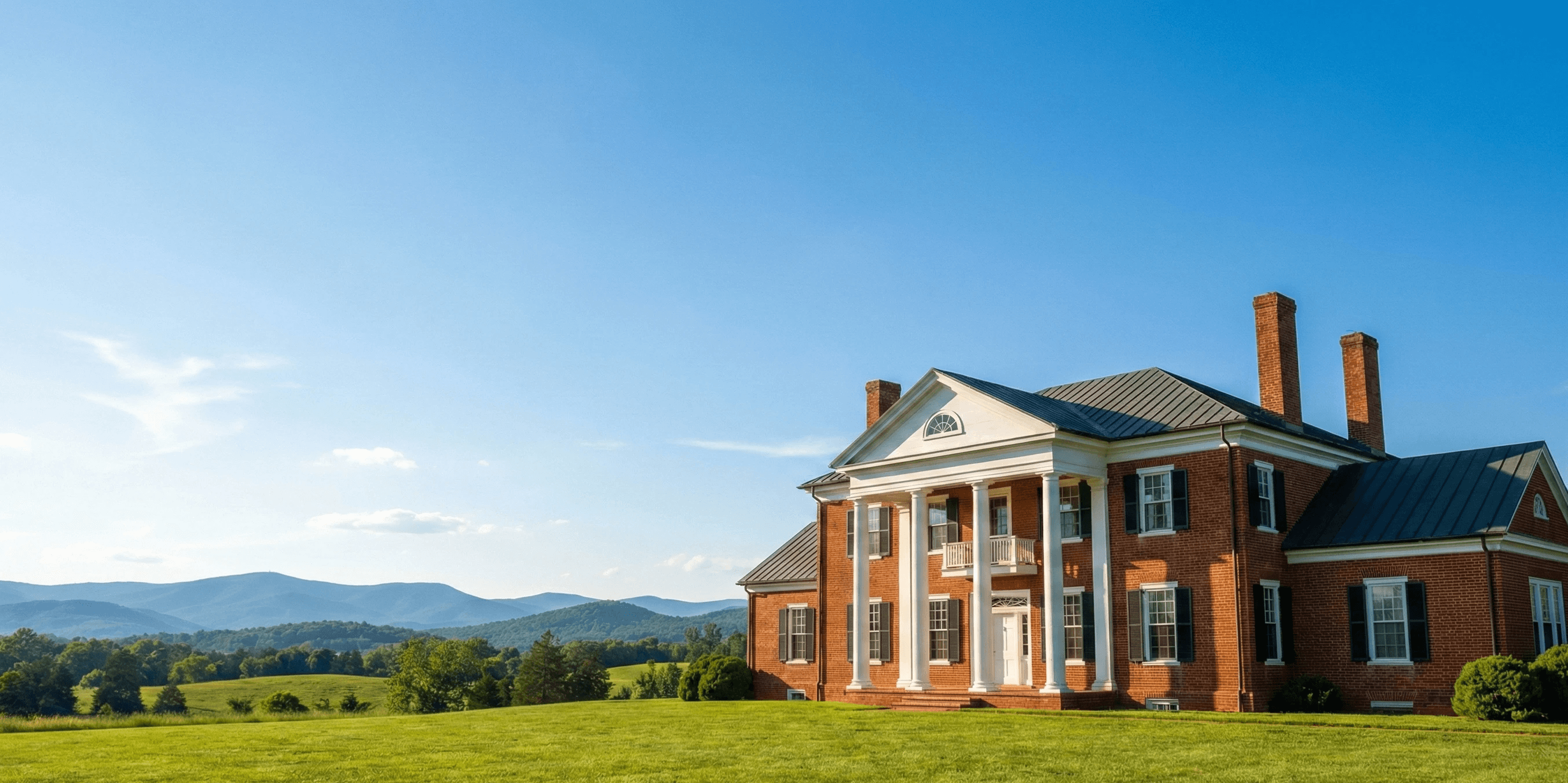 Charlottesville real estate landscape showing luxury home and Blue Ridge Mountains - Massie Realty