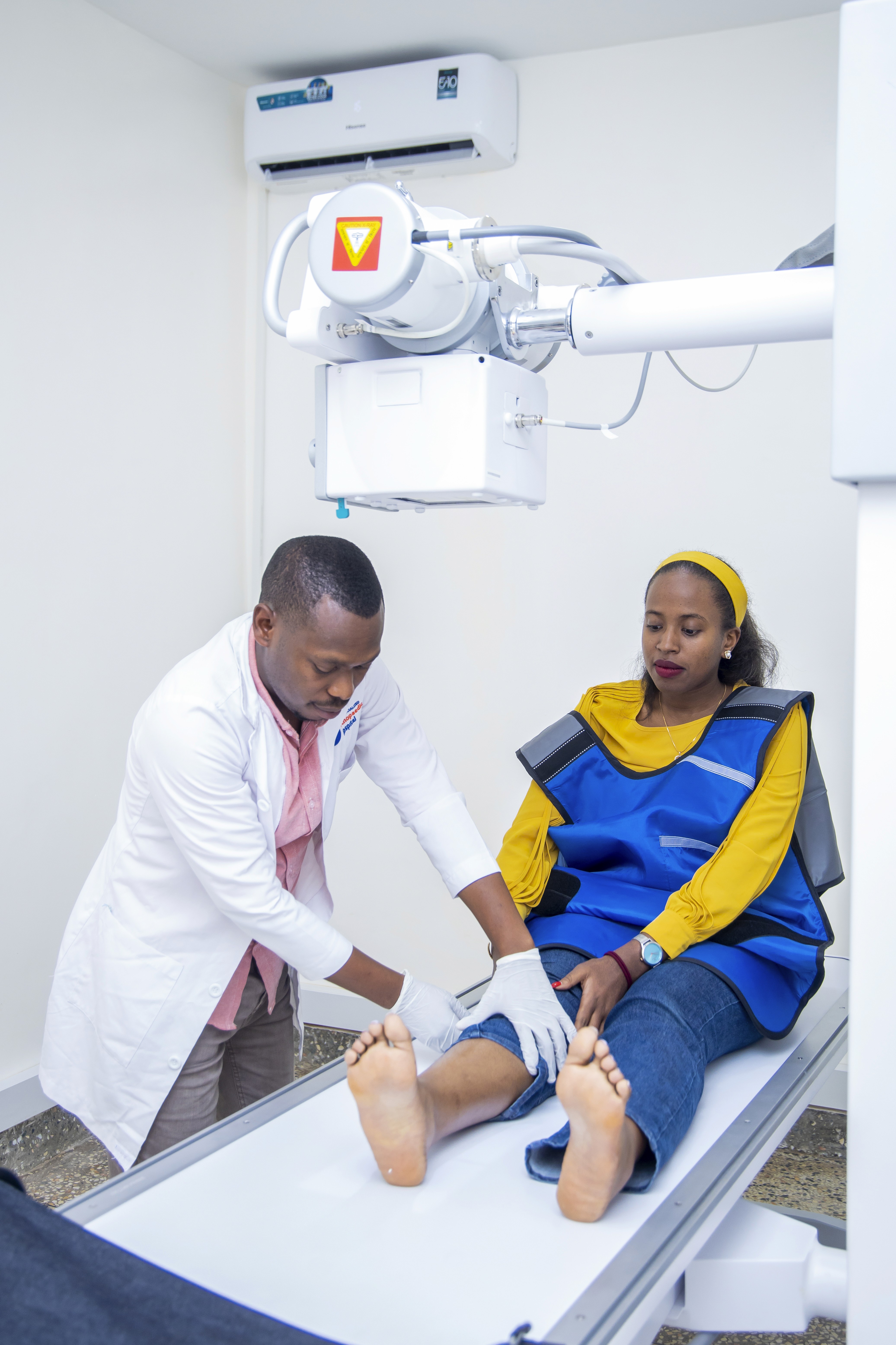 Doctor and patient holding hands after good news