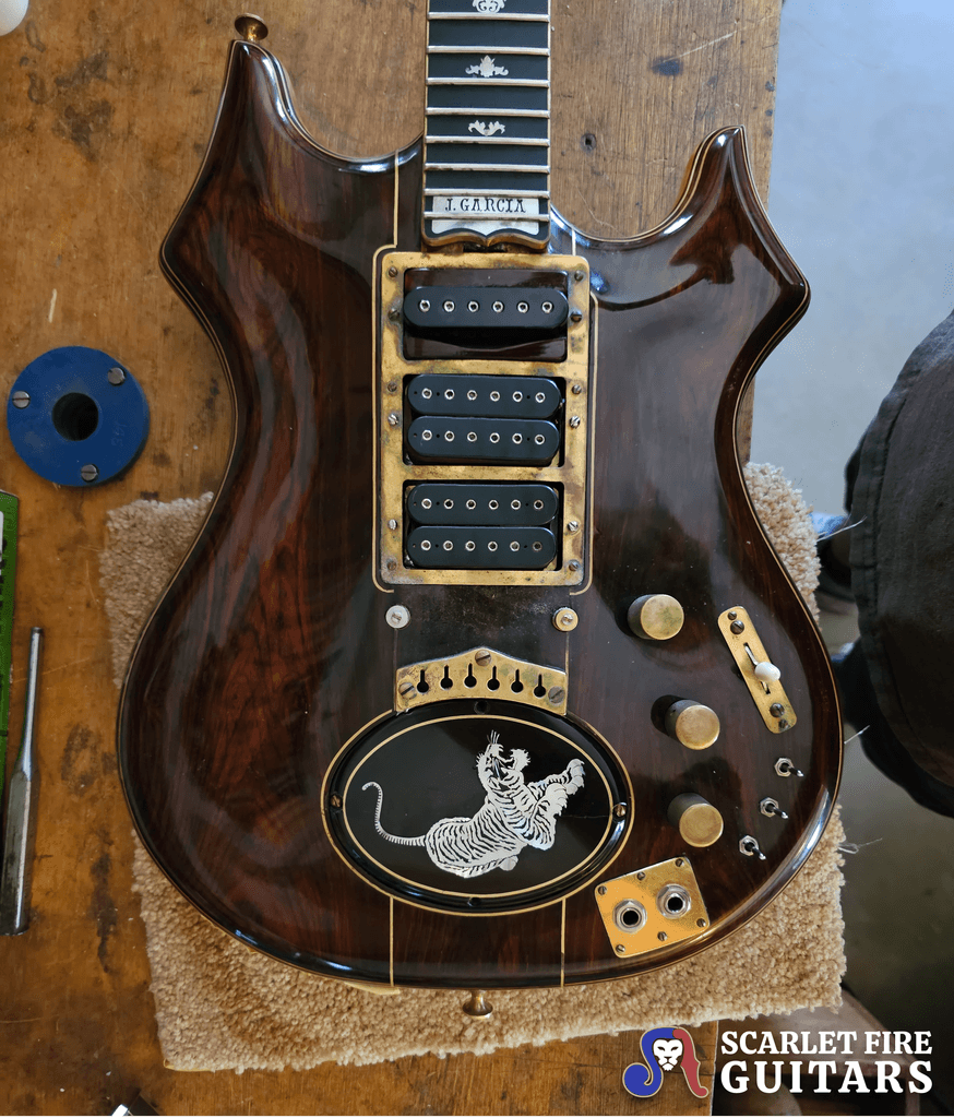 Jerry Garcia's original tiger guitar on the workbench (body front), Doug Irwin's shop