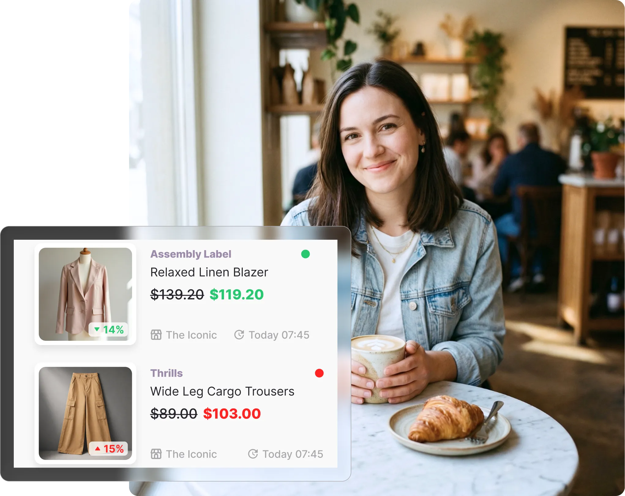 Woman in a denim jacket sitting at a café table holding a coffee, viewing her The Iconic watchlist on Whisprice showing two fashion items from different brands, with a croissant on the table beside her.