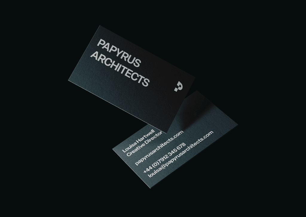 Papyrus Architects business cards floating in air.