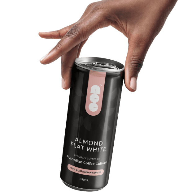 Hand holding a 250ml Almond Flat White can made with 100% Australian-grown coffee beans.