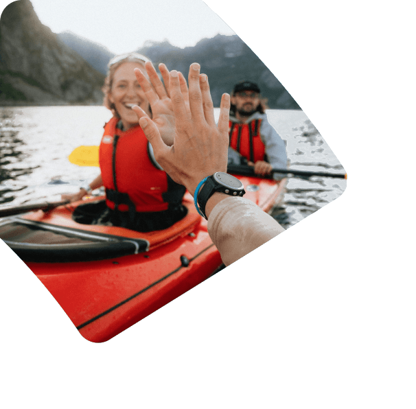 Two kayakers high-five