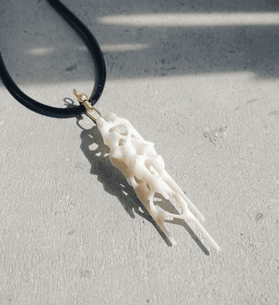 Pendant necklace generated by the game of life and 3d printed with white sla resin.